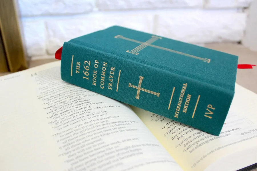 Blue Book of Common Prayer on top of an open book