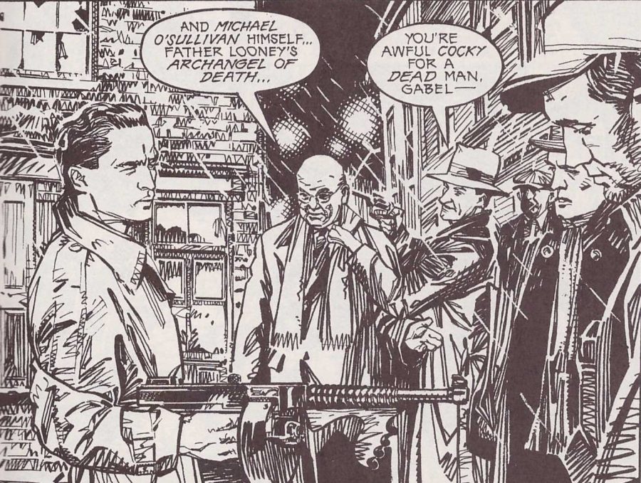 Two men hold several other men at gunpoint