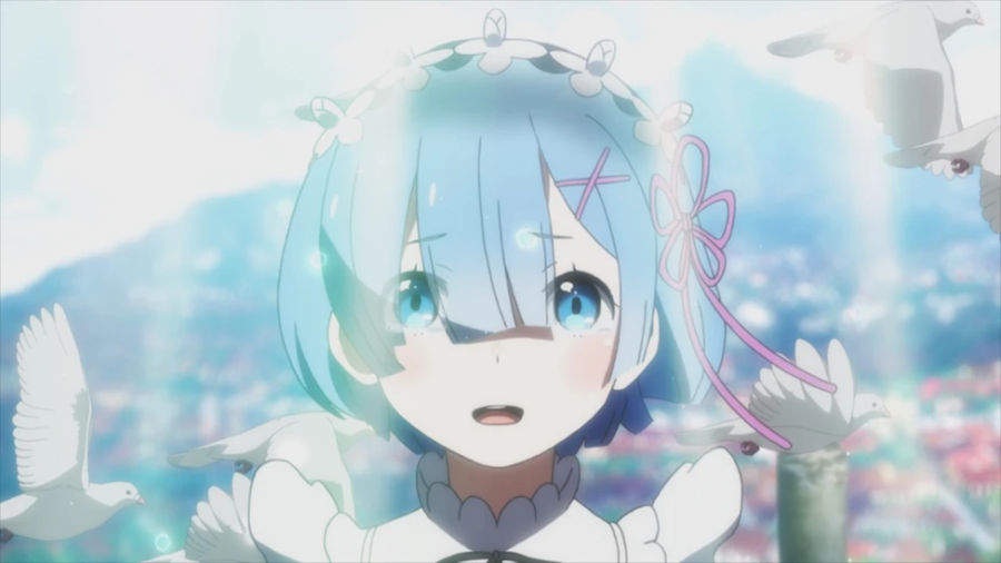 A blue-haired white girl looks earnestly at the viewer